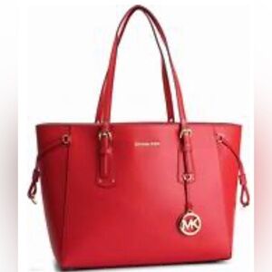 Michael Kors red leather large purse. Comes with satin drawstring bag.BRAND NEW!